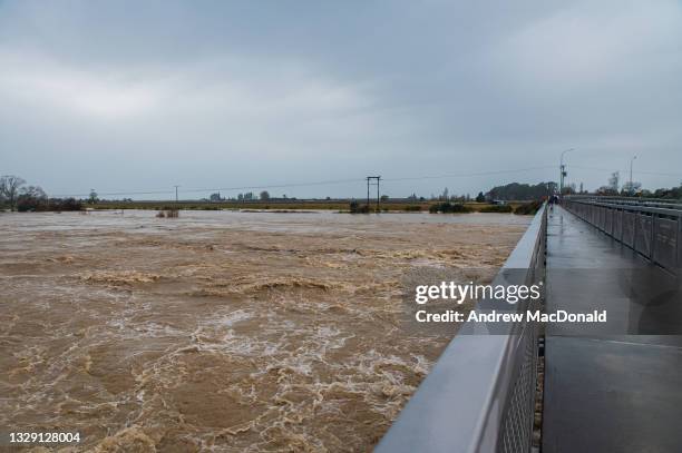 The Motueka river in flood from the main bridge on July 17, 2021 in Nelson, New Zealand. Heavy rain and flooding has led to road closures across New...