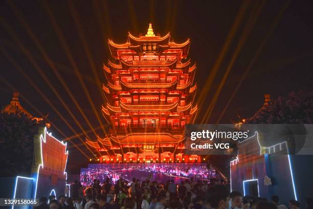 The Yellow Crane Tower is illuminated during a light show to present Wuchang city on July 16, 2021 in Wuhan, Hubei Province of China.