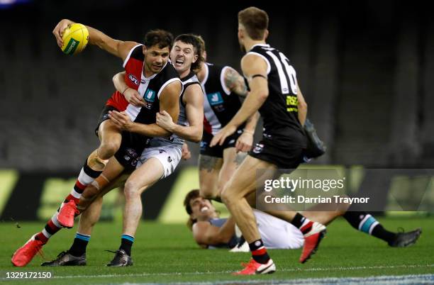 Darcy Byrne-Jones of the Power tackles Paddy Ryder of the Saints during the round 18 AFL match between St Kilda Saints and Port Adelaide Power at...