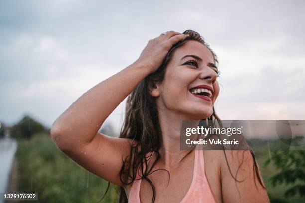 portrait of the woman enjoying the rain - saturated color stock pictures, royalty-free photos & images