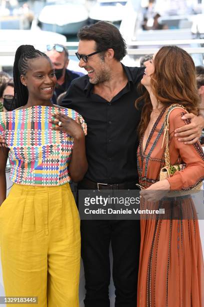Fatou N'Diaye, Nicolas Bedos and Natacha Lindinger attend the "OSS 117: From Africa With Love" photocall during the 74th annual Cannes Film Festival...