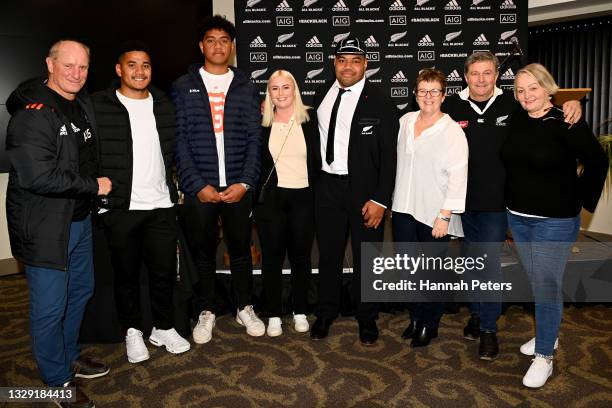 Samisoni Taukei'aho of the All Blacks poses for a photo with his family after being presented with his new cap following the International Test Match...