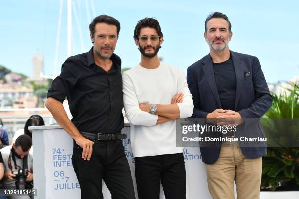 Nicolas Bedos, Pierre Niney and Jean Dujardin attend the "OSS 117: From Africa With Love" photocall during the 74th annual Cannes Film Festival on...