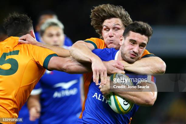 Baptise Couilloud of France is tackled by Michael Hooper of the Wallabies during the International Test Match between the Australian Wallabies and...
