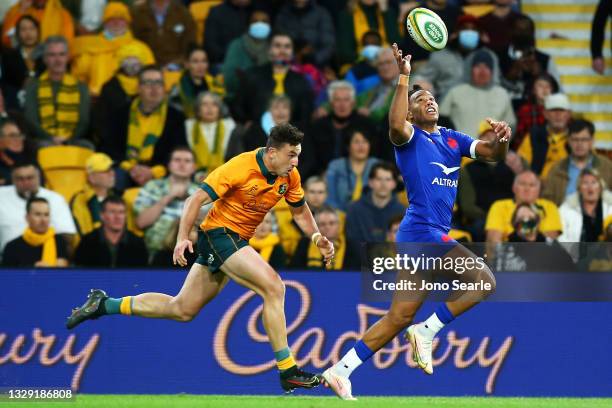 Teddy Thomas of France catches the ball under pressure from Thomas Banks of the Wallabies during the International Test Match between the Australian...