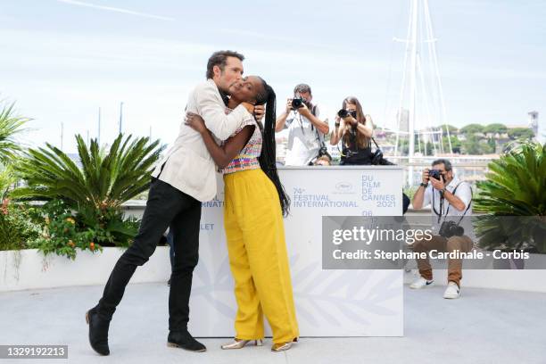 Nicolas Bedos and Fatou N'Diaye attend the "OSS 117: From Africa With Love" photocall during the 74th annual Cannes Film Festival on July 17, 2021 in...