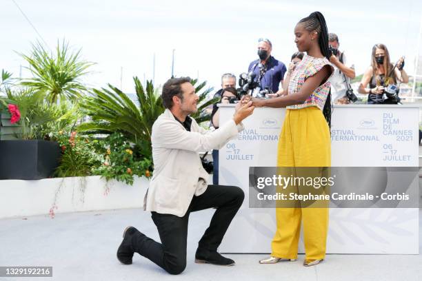 Nicolas Bedos and Fatou N'Diaye attend the "OSS 117: From Africa With Love" photocall during the 74th annual Cannes Film Festival on July 17, 2021 in...