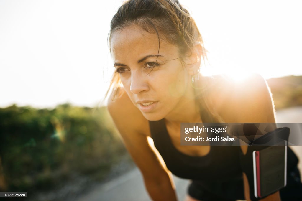 Woman having a break during workout