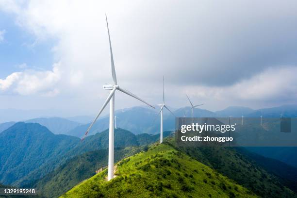 alpine meadows and wind power - windmill stock pictures, royalty-free photos & images