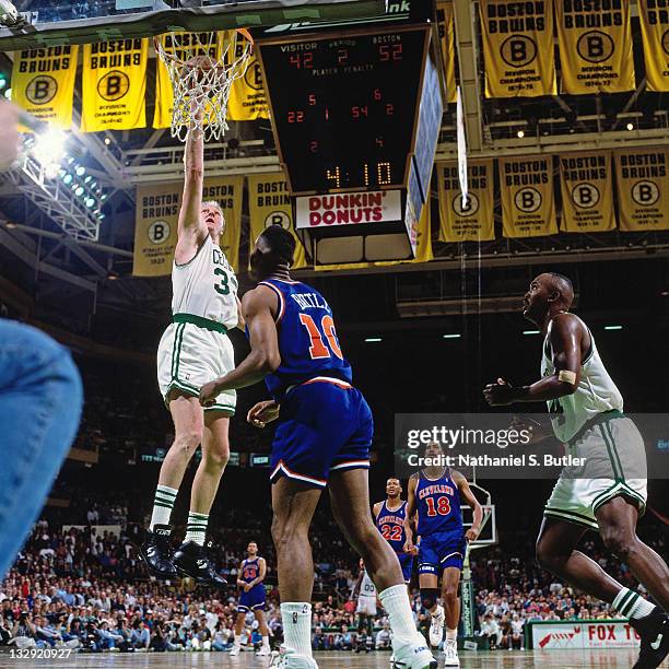 Larry Bird of the Boston Celtics shoots against John Battle of the Cleveland Cavaliers at the Boston Garden in Boston, Massachusetts circa 1991. NOTE...
