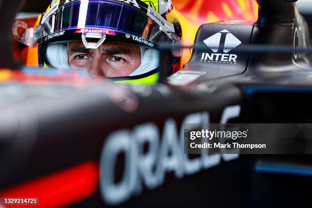 Sergio Perez of Mexico and Red Bull Racing prepares to drive in the garage before the Sprint for the F1 Grand Prix of Great Britain at Silverstone on...