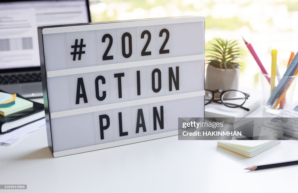 2022 action plan text on light box on desk table in office