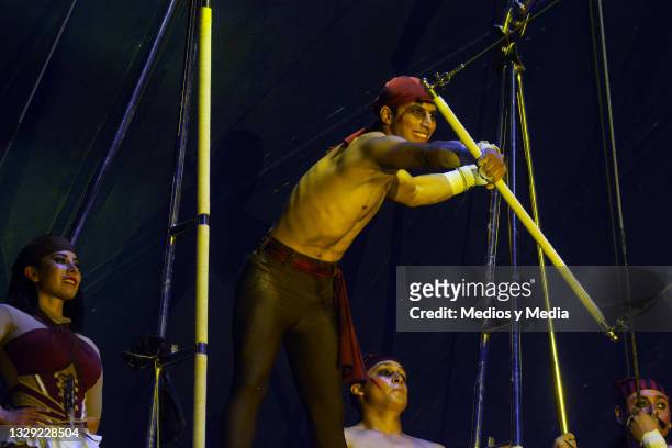 Acrobat about to launch himself on the trapeze during a show by the 'Atayde Circus' company called BARDUM, in honor to the first circus in history,...