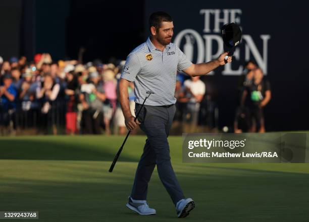 Louis Oosthuizen of South Africa acknowledges the crowd on the 18th green during Day Three of The 149th Open at Royal St George’s Golf Club on July...