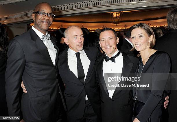 Former track and field athlete Ed Moses, former boxer Barry McGuigan, horse racing jockey Frankie Dettori and wife Catherine Dettori attend the...