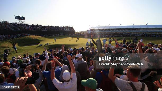 Spectators cheer for Louis Oosthuizen of South Africa on the 16th green during Day Three of The 149th Open at Royal St George’s Golf Club on July 17,...