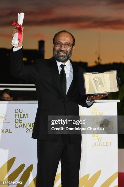 Asghar Farhadi poses with the 'Grand Prix' Ex-Aequo for 'A Hero' during the 74th annual Cannes Film Festival on July 17, 2021 in Cannes, France.