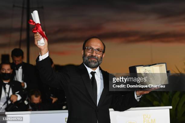 Asghar Farhadi poses with the 'Grand Prix' Ex-Aequo for 'A Hero' during the 74th annual Cannes Film Festival on July 17, 2021 in Cannes, France.