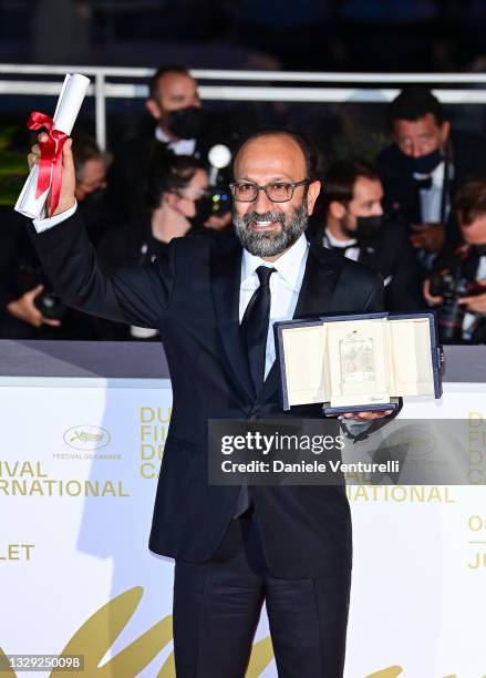 Asghar Farhadi poses with the 'Grand Prix' Ex-Aequo for 'A Hero' during the 74th annual Cannes Film Festival on July 17, 2021 in Cannes, France.