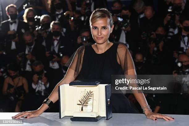 Julia Ducournau poses with the Palme d'Or 'Best Movie Award' for 'Titane' during the 74th annual Cannes Film Festival on July 17, 2021 in Cannes,...