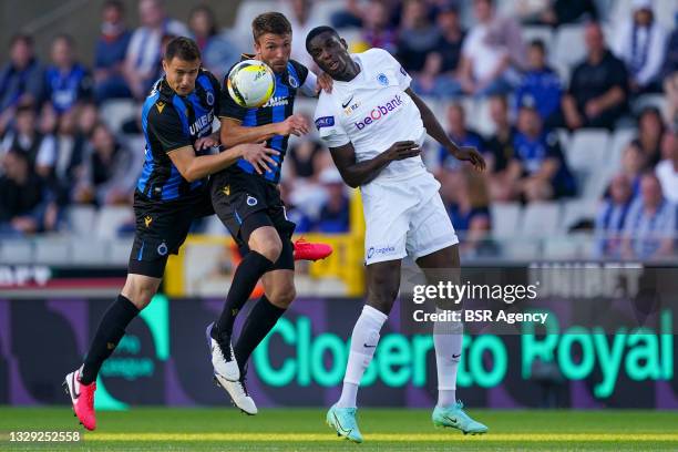 Paul Onuachu of KRC Genk battles for possession with Brandon Mechele of Club Brugge and Matej Mitrovic of Club Brugge during the Pro League Supercup...