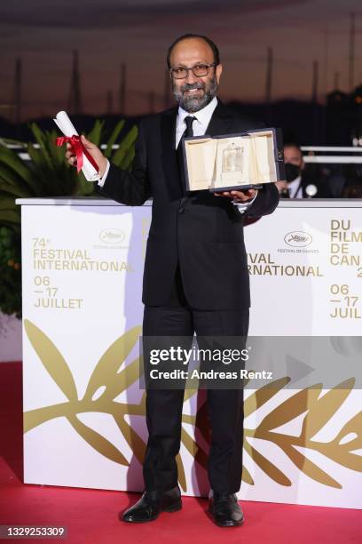 Asghar Farhadi poses with the 'Grand Prix' Ex-Aequo for 'A Hero' during the 74th annual Cannes Film Festival on July 17, 2021 in Cannes, France.