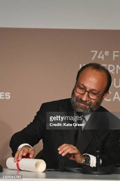 Asghar Farhadi, winner of the 'Grand Prix' Ex-Aequo for 'A Hero', attends the closing ceremony press conference during the 74th annual Cannes Film...