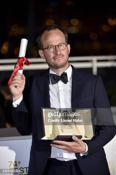 Juho Kuosmanen poses with the 'Grand Prix' Ex-Aequo for 'Hytti nro 6' during the 74th annual Cannes Film Festival on July 17, 2021 in Cannes, France.