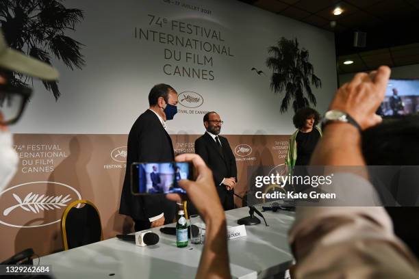 Didier Allouch and Asghar Farhadi, winner of the 'Grand Prix' Ex-Aequo for 'A Hero', attend the closing ceremony press conference during the 74th...