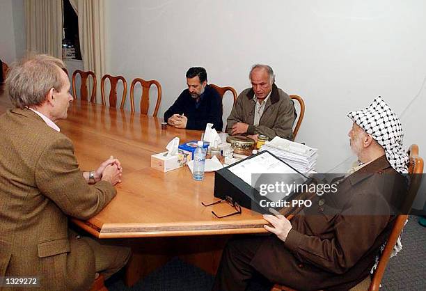 Palestinian leader Yasser Arafat meets with Alister Cook , deputy European Union envoy, Salah Taamar , Bethlehem''s governor and Nabil Abu Rdainah ,...