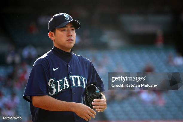 Yusei Kikuchi of the Seattle Mariners looks on before the game against the Los Angeles Angels at Angel Stadium of Anaheim on July 17, 2021 in...