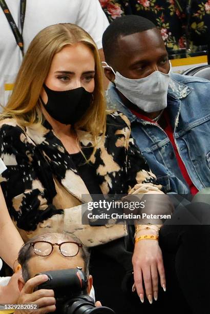 Singer Adele looks on next to Rich Paul during the first half in Game Five of the NBA Finals between the Milwaukee Bucks and the Phoenix Suns at...