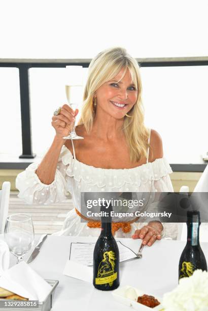 Christie Brinkley attends the Haute Living Celebration; Christie Brinkley With Wine Access at Gurney's Montauk on July 17, 2021 in Montauk, New York.