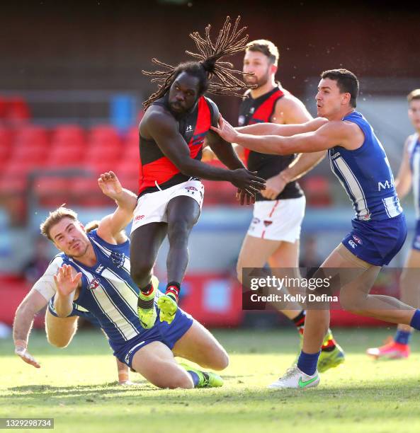 Anthony McDonald-Tipungwuti of Essendon kicks the ball during the round 18 AFL match between North Melbourne Kangaroos and Essendon Bombers at...