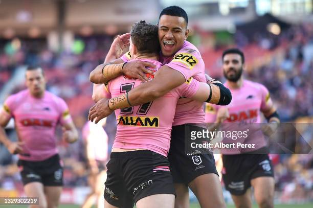 Liam Martin of the Panthers celebrates with Stephen Crichton after scoring a try during the round 18 NRL match between the New Zealand Warriors and...