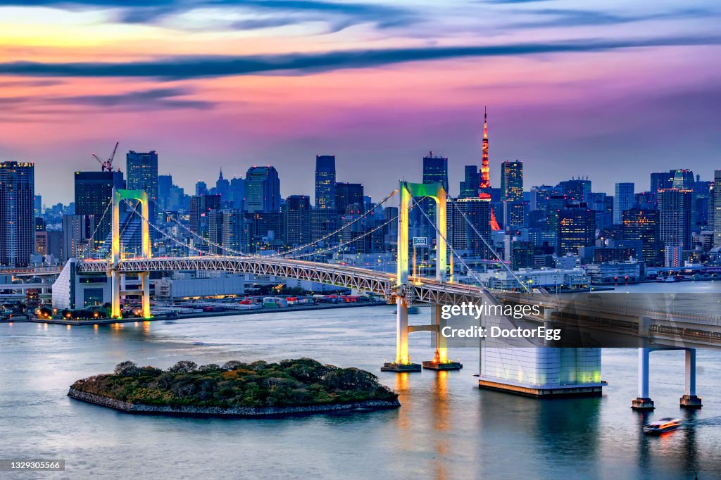 Rainbow bridge Illumination at Sunset with Tokyo Tower Background, Odaiba, Tokyo, Japan