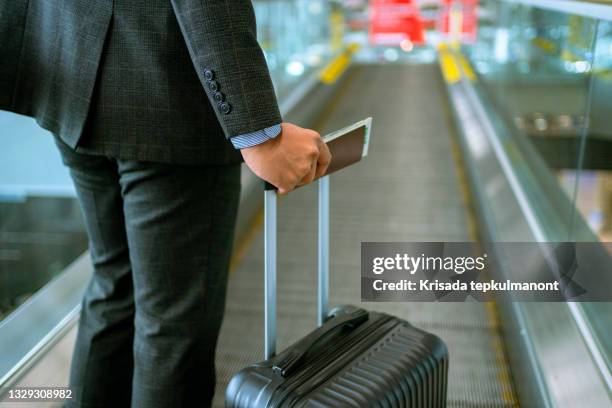 businessman walk with his luggage on escalator . - indian arrival stock pictures, royalty-free photos & images