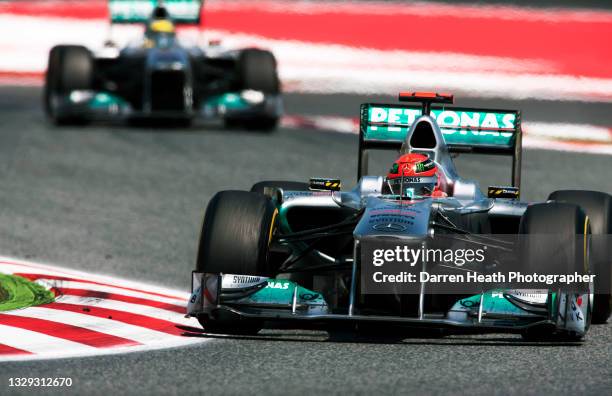 German Mercedes AMG Formula One racing driver Michael Schumacher driving his MGP W02 racing car ahead of his German teammate Nico Rosberg during the...