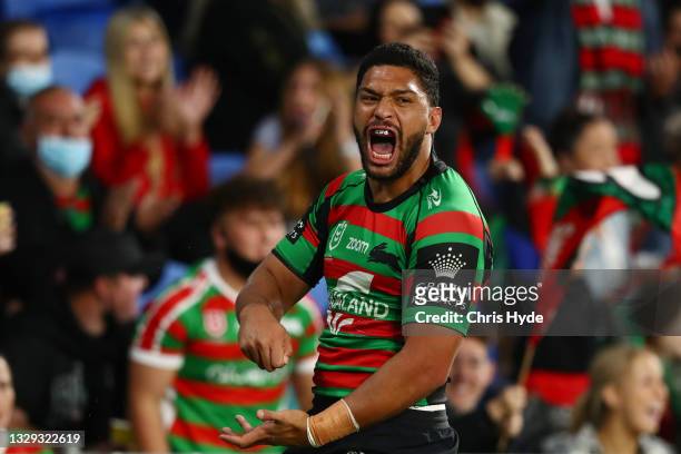 Taane Milne of the Rabbitohs celebrates a try during the round 18 NRL match between the South Sydney Rabbitohs and the Canterbury Bulldogs at Cbus...