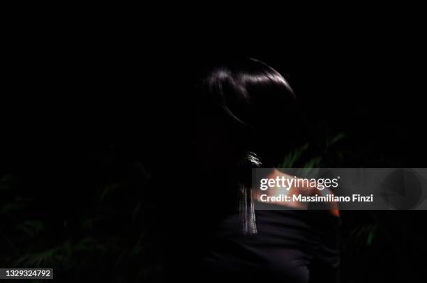 blurred image of a woman shape in the darkness - portrait dark background stock pictures, royalty-free photos & images