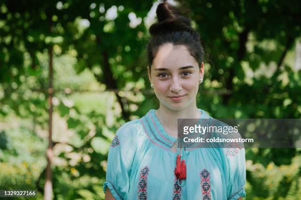 young woman wearing traditional romanian clothing - beautiful romanian women stock pictures, royalty-free photos & images
