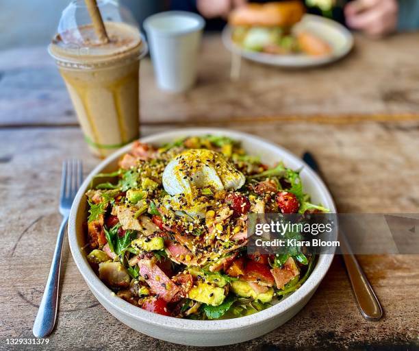 cafe savory breakfast in handmade ceramic bowl - quinoa stock pictures, royalty-free photos & images