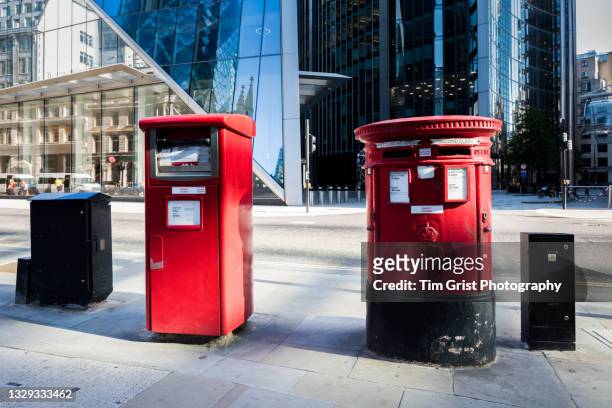 red british post boxes in a city of london street - post brexit stock pictures, royalty-free photos & images