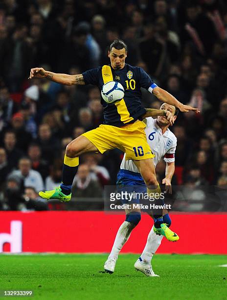 Zlatan Ibrahimovic of Sweden beats John Terry of England to the ball during the international friendly match between England and Sweden at Wembley...