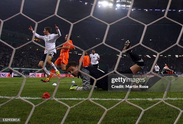 Thomas Mueller of Germany celebrates after he scores his team's opening goal during the International friendly match between Germany and Netherlands...