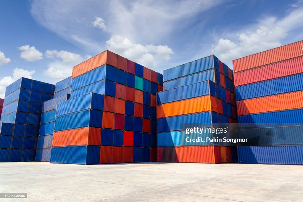 Many colorful container box in shipyard with blue sky in sunny day