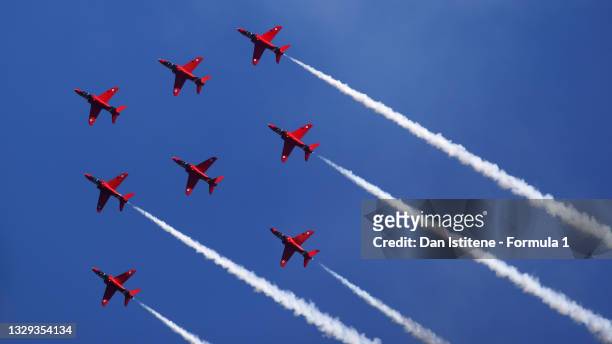 The Red Arrows perform above the circuit before the F1 Grand Prix of Great Britain at Silverstone on July 18, 2021 in Northampton, England.