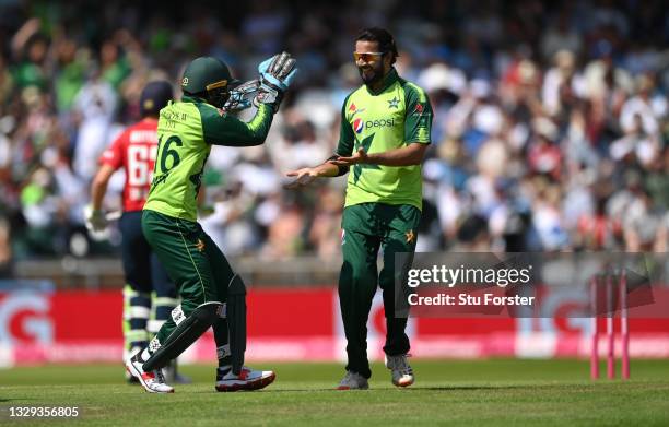 Pakistan bowler Imad Wasim celebrates with team mates after taking the wicket of Dawid Malan during the Second Vitality Blast IT20 between England...