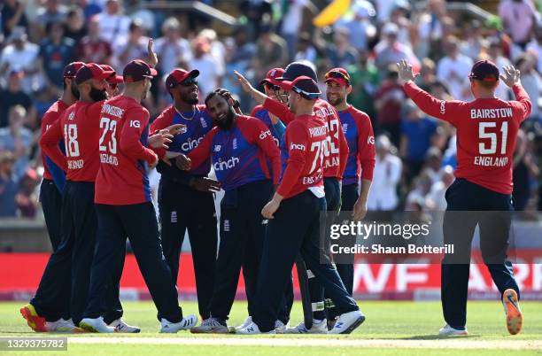 Adil Rashid of England celebrates with team mates after taking the wicket of Mohammad Rizwan of Pakistan during the second Vitality International T20...