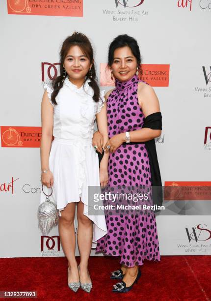 Maggie Huang and Nini Jiang arrive at Grand Opening of Winn Slavin Fine Art Rodeo Drive on July 10, 2021 in Beverly Hills, California.